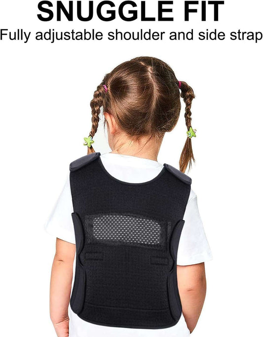 Child wearing large black weighted vest for kids with adjustable straps and breathable mesh back.
