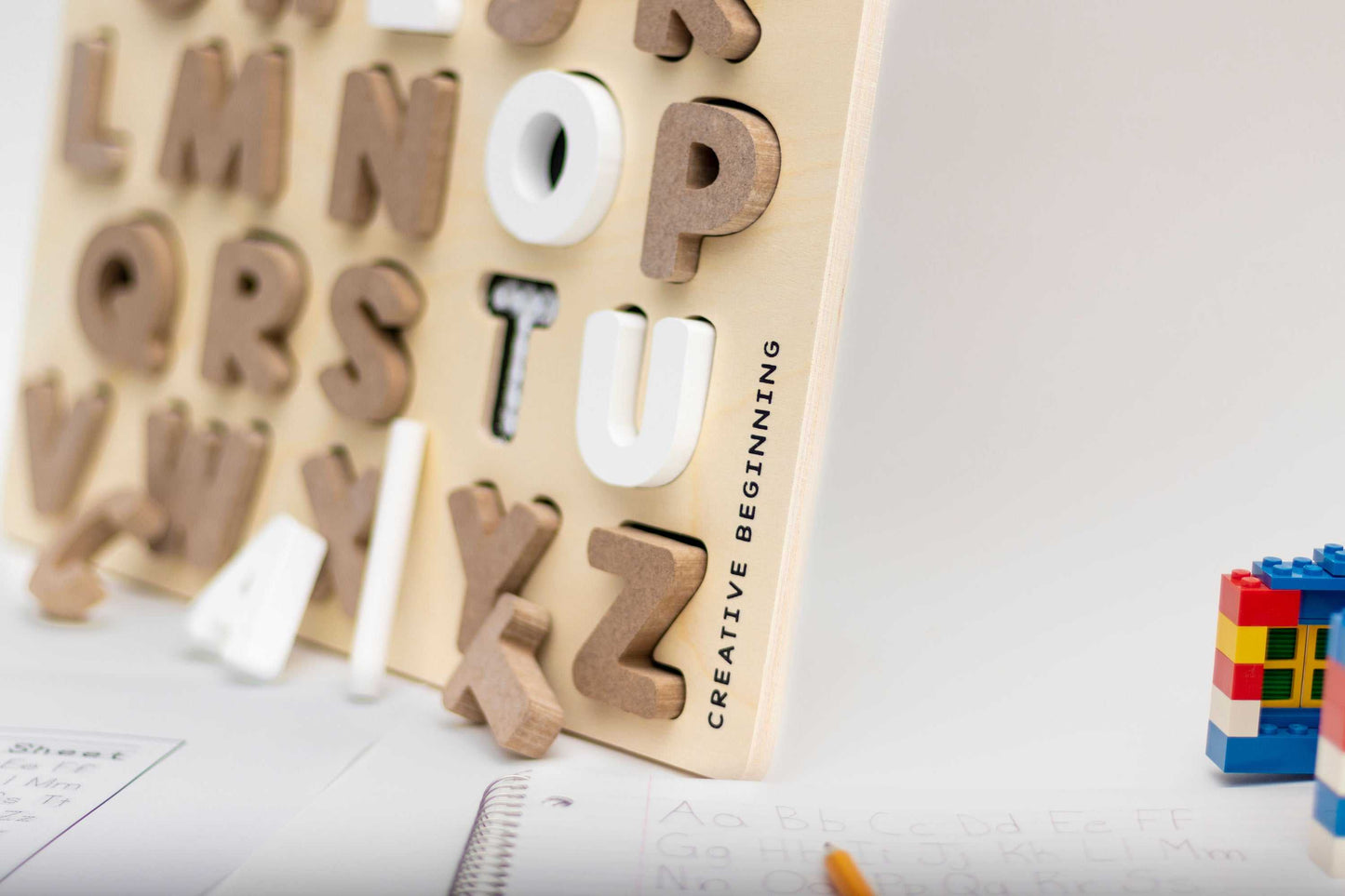 Alphabetical puzzle with chalkboard base and tracers for educational learning
