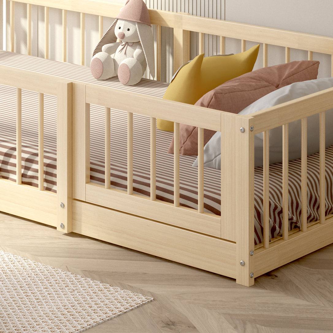 Dream Raft Montessori natural floor bed in New Zealand pine with protective guardrails and nautical-inspired design
