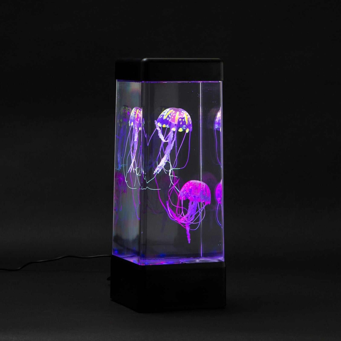 JINX Luminous Jellyfish sensory mood lamp with glowing purple and blue jellyfish in a transparent tank