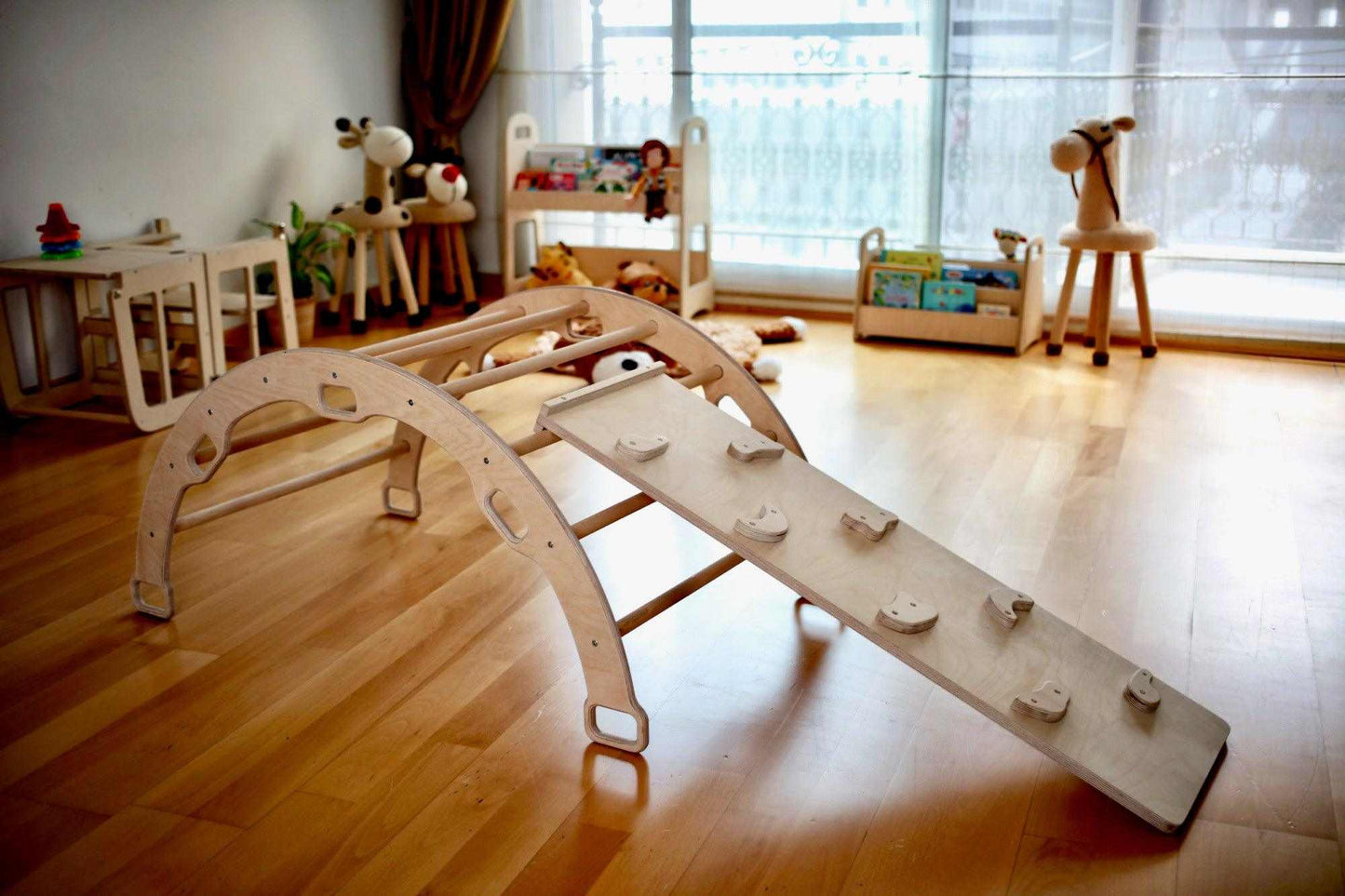Montessori Climbing Set with wooden Pikler triangle, climbing arch, and ramp in a children's playroom