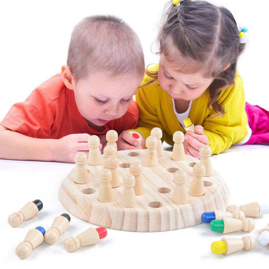 Children playing with Kids Wooden Memory Match Stick Chess Game on wooden board