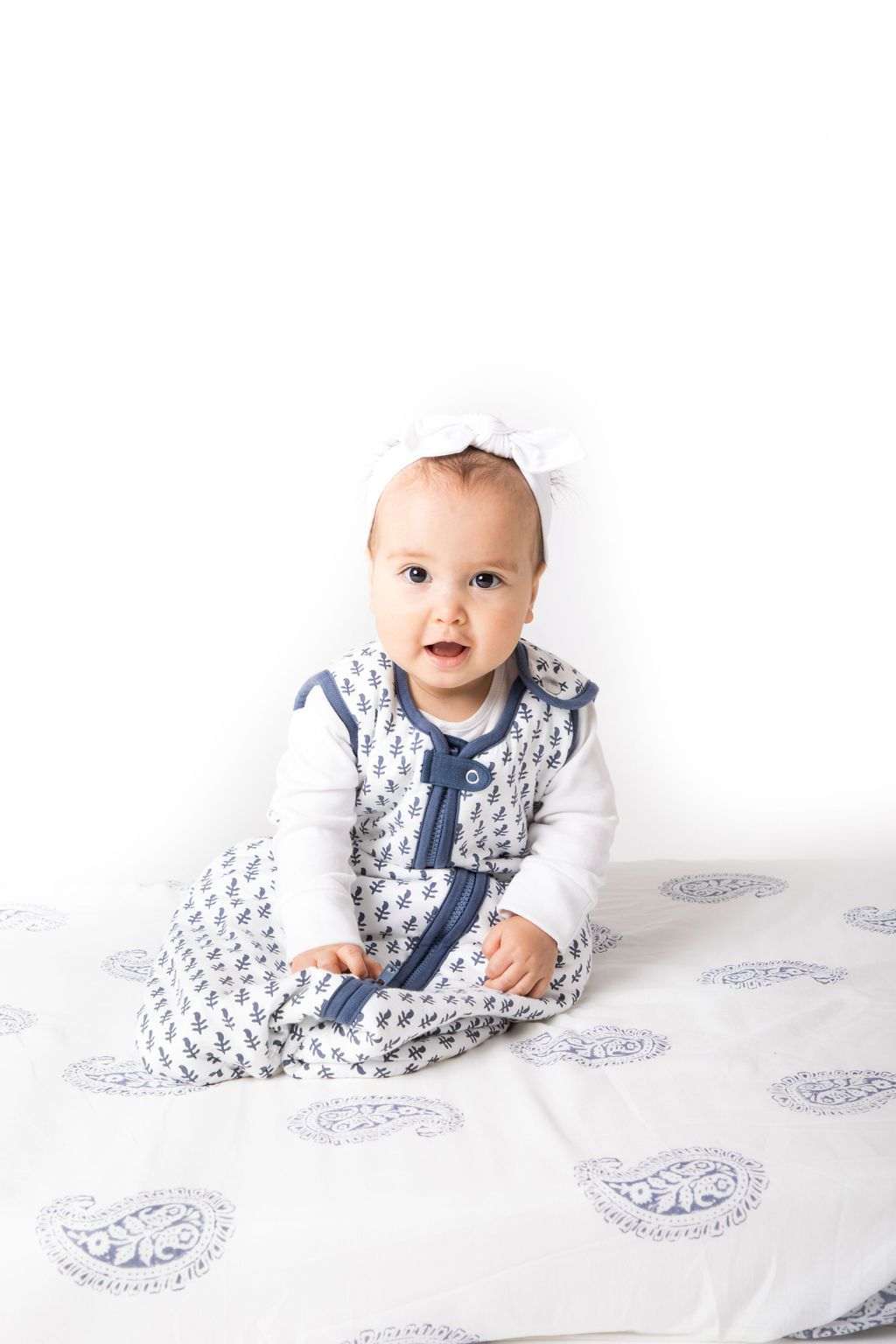 Baby wearing FORT Wearable Baby Sleep Bag lightweight organic cotton blanket with shoulder snap closure