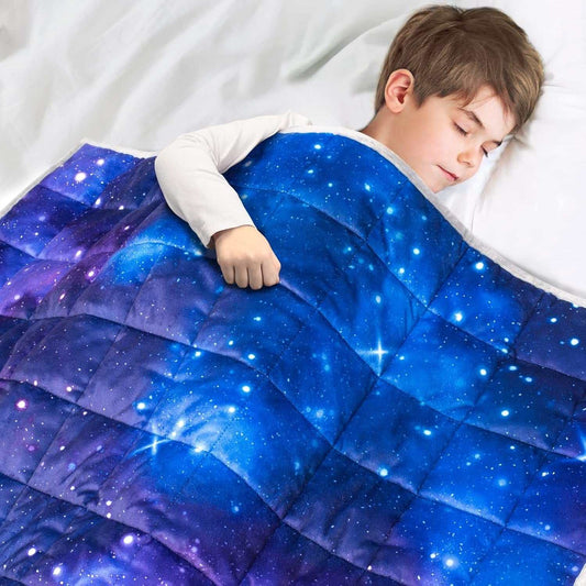 Child sleeping under Solfres 7lbs weighted blanket with soft galaxy print sensory design